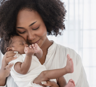 A mother holding her new baby