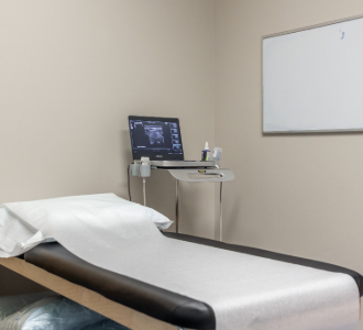 An exam table and medical machines